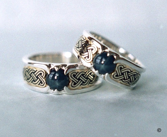 Double lined Silver and Yellow Gold Celtic Heart Shield Rings, set with blue star Sapphires